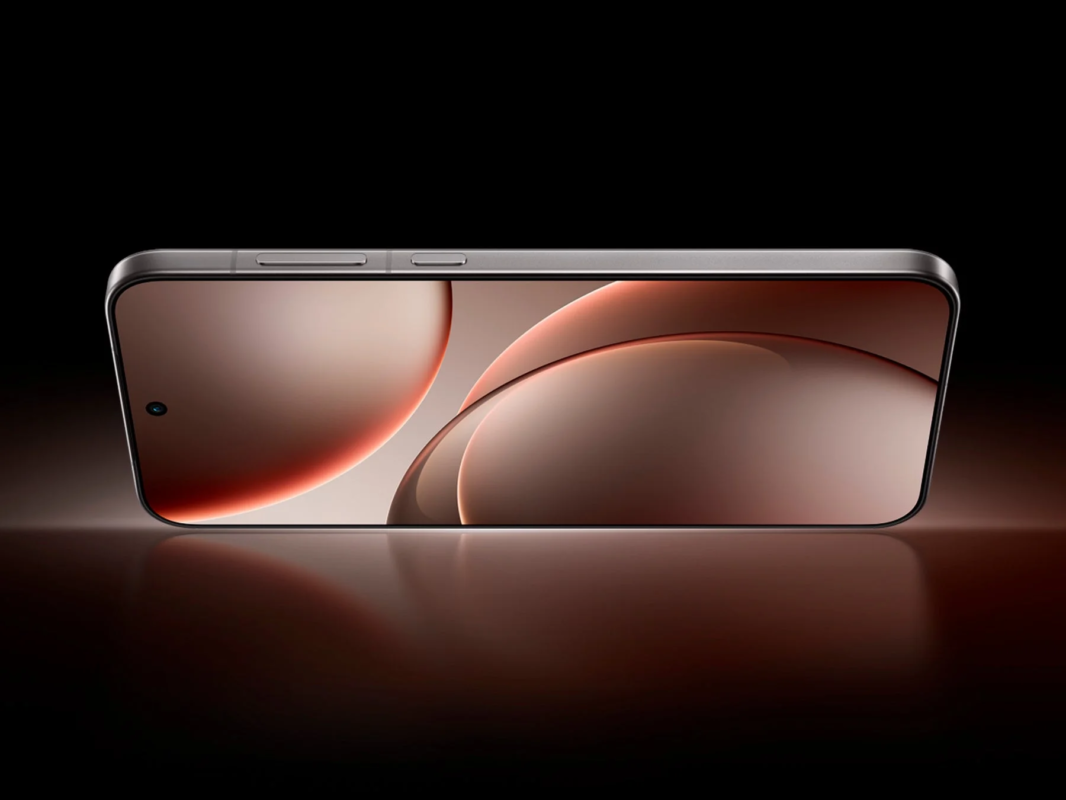 暗い背景に置かれた、横向きの最新スマートフォン